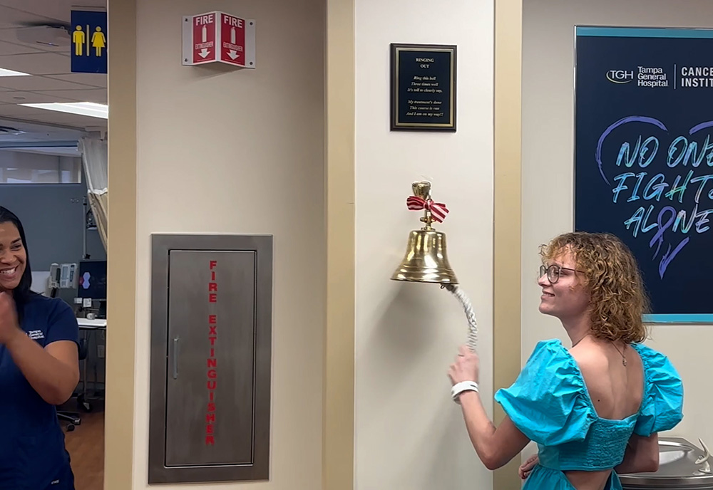 Kylie ringing the bell after her final cancer treatment