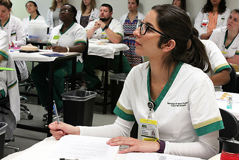 Students listen to a lecture at USF College of Nursing.