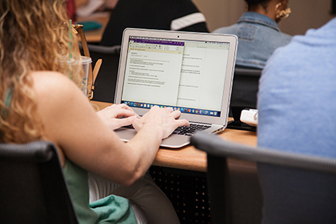 A student working on a laptop