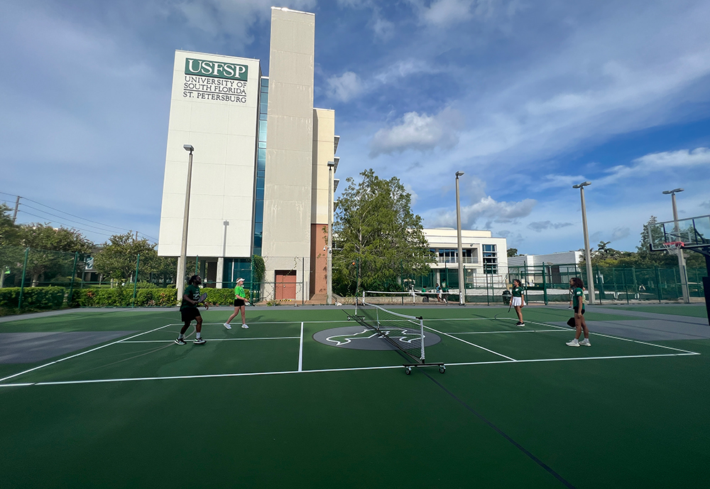 Students playing on the new pickleball courts at USF St. Petersburg.