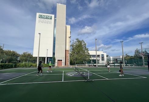 Students playing on the new pickleball courts at USF St. Petersburg.