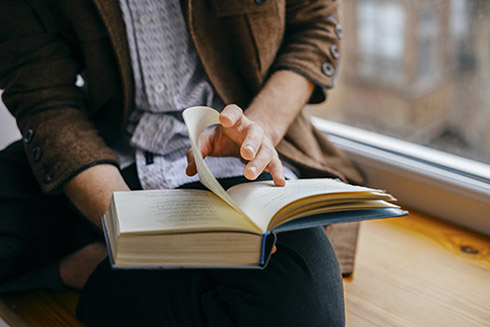 a person looking through a book