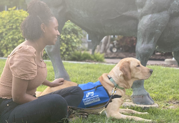 Puppy raiser Leila-Aolani DeClouet-Grant with guide dog she trained in Puppy Love program