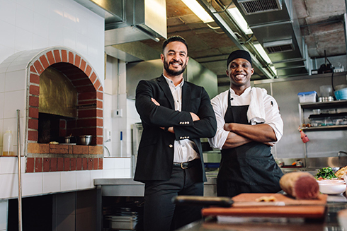 Canva restaurant manager with chef in kitchen