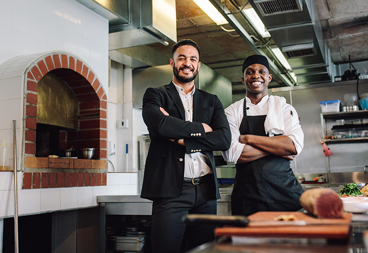 Canva restaurant manager with chef in kitchen