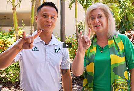 Todd Post, the assistant director of our Office of Veterans Success & Chancellor Christine Hardigree giving the bulls hand sign