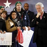 Students posing with President Clinton