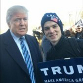 Student posing with President Trump