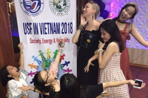 Emma Roberson and Minh Anh Nguyen take part in the opening ceremony for the education abroad program in Vietnam.