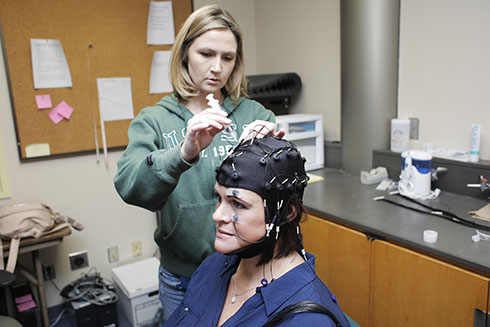 USF St. Petersburg graduate student Jaclyn Dell conducts research in cognitive and physiological psychology.