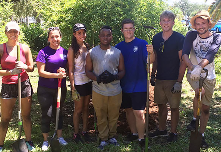 USFSP students working in the butterfly garden on the USFSP campus