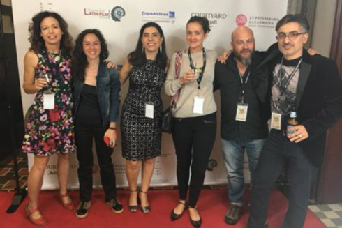 Dr. Martine F. Wagner stands with artists and directors at the first inaugural Tampa Bay Latin Film Festival.