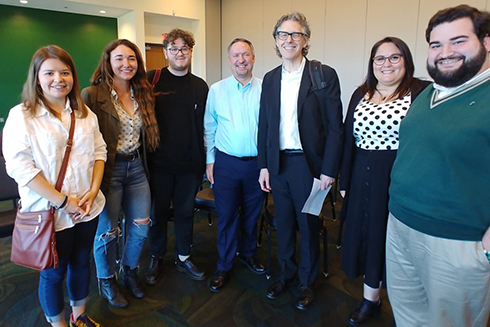 Ira Glass posing with USF St. Petersburg students