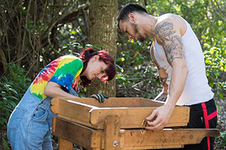 Shana Boyer and Andrew Haines adjusting a screen at the Weedon Island Archaeological site.