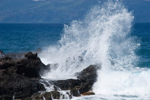 Waves crashing on a rock