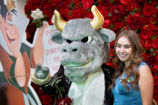 Rocky and student pose for photo at the Royalty Ball
