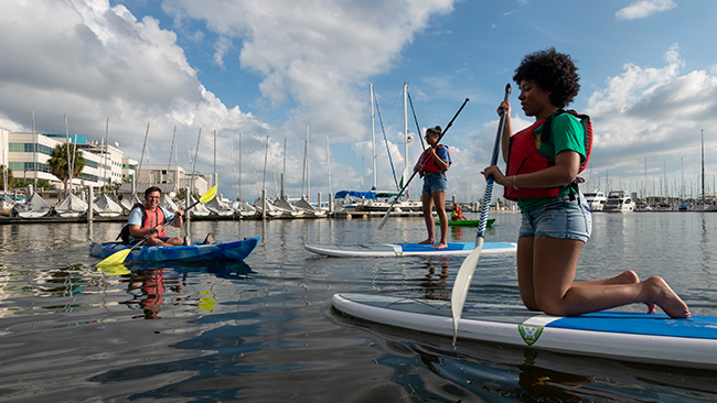 Students enjoy Paddleboarding. 